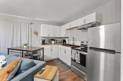 a kitchen with a couch and a table in a room at Tranquil Retreat: Cozy 2Bed, 1Bath Oasis in Fallon in Fallon