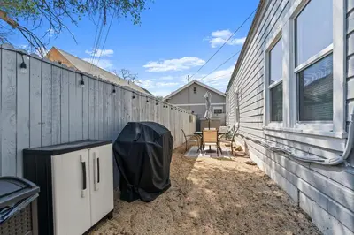 a backyard with a fence next to a building at Tranquil Retreat: Cozy 2Bed, 1Bath Oasis in Fallon in Fallon