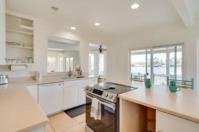 a kitchen with white cabinets and a counter top at Discovery Bay Home with On-Site Delta Access! in Discovery Bay