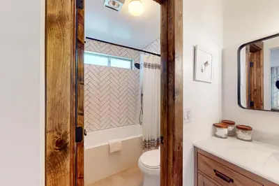 a bathroom with a toilet and a sink at Pine Haven Retreat in Stateline