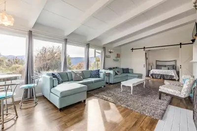 a living room with two couches and a fireplace at Black Bear Suite Hot Tub Sleeps 4 affordable in Oakhurst