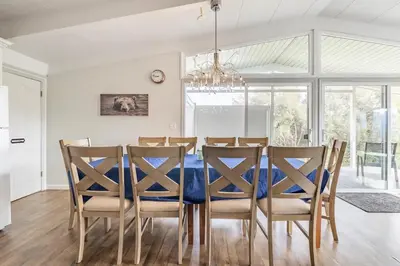 a dining room with a blue table and chairs at Black Bear Suite Hot Tub Sleeps 4 affordable in Oakhurst