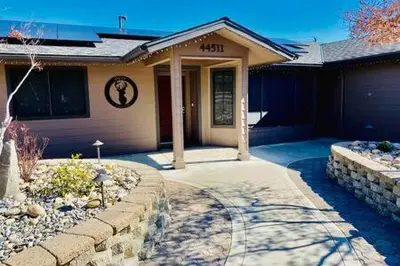 a house with a stone walkway in front of it at Deer Haven Hot Tub Foosball Pool Table in Ahwahnee
