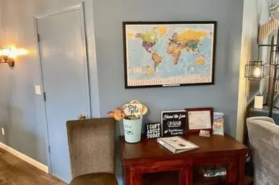 a room with a desk with a map on the wall at Deer Suite HOT TUB GAME ROOM SLEEPS 2 in Ahwahnee