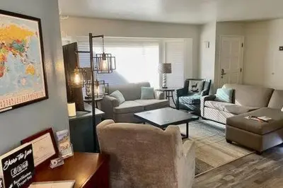 a living room with a couch and a table at Deer Suite HOT TUB GAME ROOM SLEEPS 2 in Ahwahnee