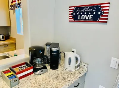 a kitchen counter with a coffee maker on it at Eagle Nest River Views Hot Tub Games Sleeps 6 in Ahwahnee