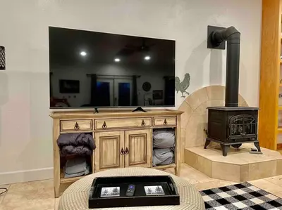 a living room with a wood stove in a room at The Funky Chicken Hot Tub BBQ SLEEPS 4 in Ahwahnee