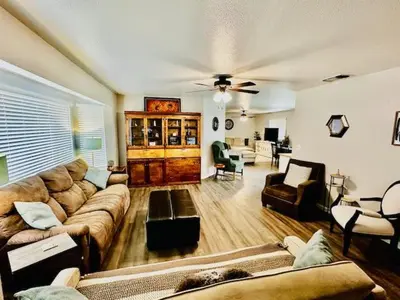 a large living room with couches and a couch at The Lighthouse Pet Friendly Hot Tub BBQ Sleeps 11 in Coarsegold