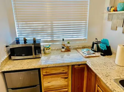 a kitchen with a counter top with a microwave at Owl Nest Hot Tub Sleeps 3 Yosemite in Ahwahnee