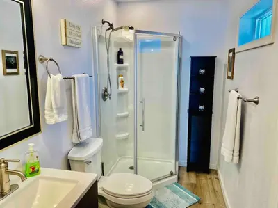 a bathroom with a shower and a toilet and a sink at Owl Nest Hot Tub Sleeps 3 Yosemite in Ahwahnee