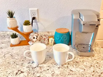 a counter with two coffee cups and a toaster at Owl Nest Hot Tub Sleeps 3 Yosemite in Ahwahnee