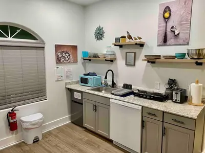 a kitchen with a sink and a counter top at Quail Suite HOT TUB BBQ Sleeps 2 in Ahwahnee