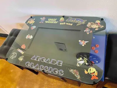a table with a cake on top of it at Raccoon Hideout Hot Tub BBQ Arcade Darts in Oakhurst