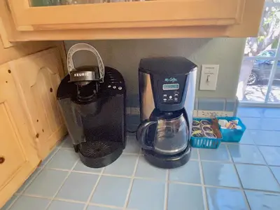 a coffee maker on a counter in a kitchen at Squirrel View Hot tub BBQ Patio Shuffle Board in Oakhurst