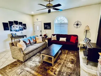 a living room with a couch and a table at Wild Stallion HOT TUB Sleeps 4 Darts Private in Ahwahnee