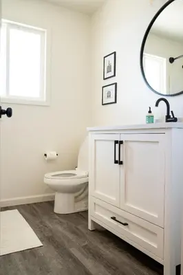 a bathroom with a white toilet and a mirror at Peaceful Mariposa Home near Yosemite National Park in Mariposa