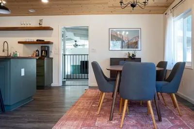 a kitchen and dining room with a table and chairs at Peaceful Mariposa Home near Yosemite National Park in Mariposa