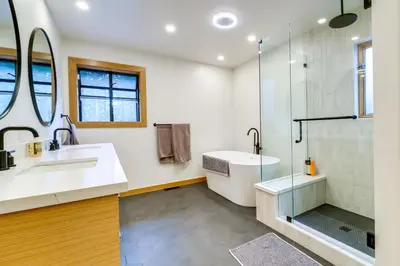 a bathroom with a sink and a shower at 5 Mi to Donner Lake Cabin with Deck and Pool Access! in Truckee
