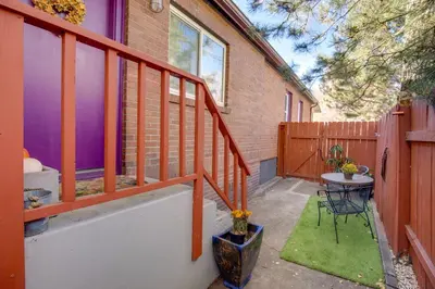 a small patio with a table and a fence at Hot Tub and Grill Pet-Friendly Apt, Walk to Midtown in Reno