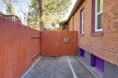 a fence with a star on it next to a house at Hot Tub and Grill Pet-Friendly Apt, Walk to Midtown in Reno
