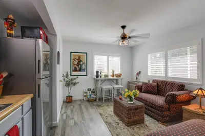 a kitchen and living room with a ceiling fan at Hot Tub and Grill Pet-Friendly Apt, Walk to Midtown in Reno