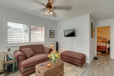 a living room with a couch and a chair at Hot Tub and Grill Pet-Friendly Apt, Walk to Midtown in Reno