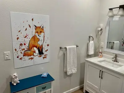 a bathroom with a painting of a fox on the wall at Foxs Den Hot Tub Bbq Queen Bed Sleeps 2 in Ahwahnee