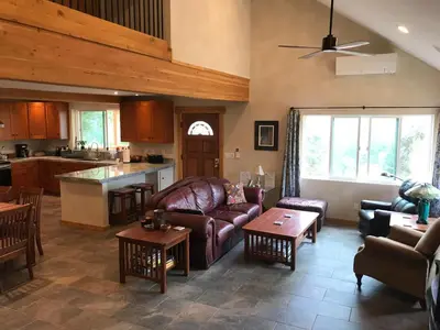 a living room with a couch and a table at Morning Star Vista near Yosemite - countryside with mountain views in Mariposa