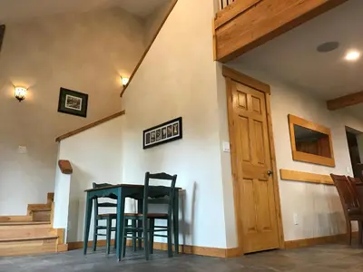 a dining room with two chairs and a table at Morning Star Vista near Yosemite - countryside with mountain views in Mariposa