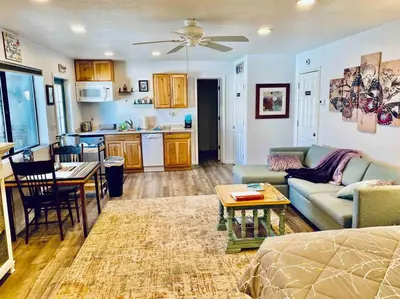 a living room with a couch and a table at Butterfly Suite Hot Tub BBQ Private in Ahwahnee