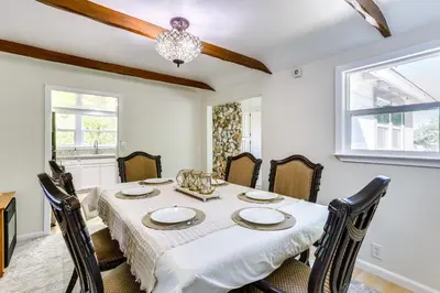 a dining room with a table and chairs at Spacious Coarsegold Getaway about 34 Mi to Yosemite! in Coarsegold