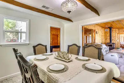 a dining room with a table and chairs at Spacious Coarsegold Getaway about 34 Mi to Yosemite! in Coarsegold