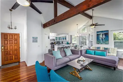 a living room with a couch and a table at **Kaweah River House** - 1/2 Mile to Sequoia Park in Three Rivers