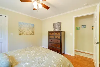 a bedroom with a bed and a ceiling fan at Groveland Vacation Rental with Private Deck and Grill! in Groveland
