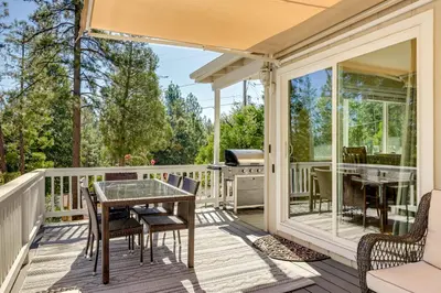 a screened porch with a table and chairs and a grill at Groveland Vacation Rental with Private Deck and Grill! in Groveland
