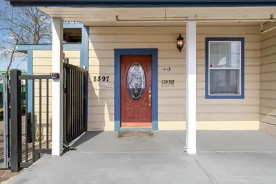 a house with a red door and a porch at Cozy 1 bdr/1br near downtown in Sacramento