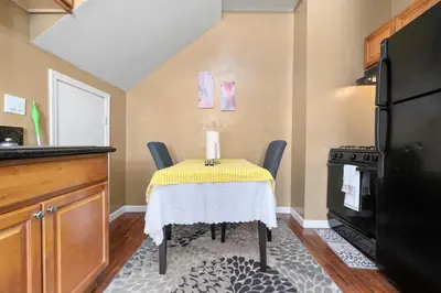 a kitchen with a table with a candle on it at Cozy 1 bdr/1br near downtown in Sacramento