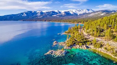 an aerial view of a large body of water with mountains at Luxury Tahoe Getaway in Incline Village in Incline Village