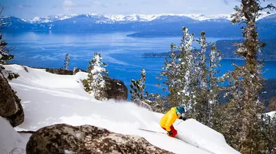 a person is skiing down a snow covered slope at Luxury Tahoe Getaway in Incline Village in Incline Village