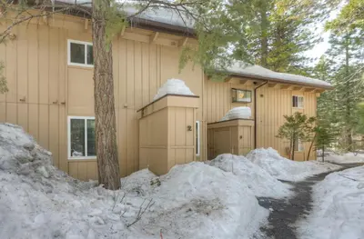 a house with snow in front of it at Luxury Tahoe Getaway in Incline Village in Incline Village