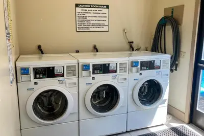 two washing machines sitting next to each other in a room at St Moritz 55 F in Mammoth Lakes
