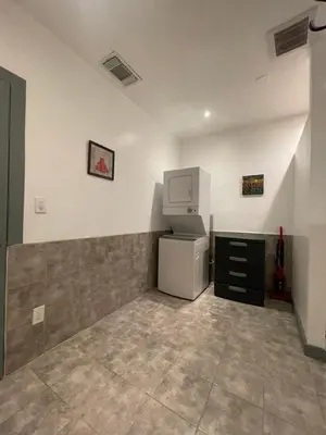 an empty room with a refrigerator and a microwave at Fresno Vacation Rental 106 in Fresno