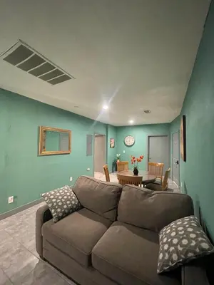 a living room with a couch and a table at Fresno Vacation Rental 106 in Fresno