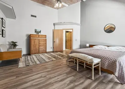 a bedroom with a bed and a wooden floor at Number 1! PARADISE Getaway - Sequoia Alta Vista in Three Rivers
