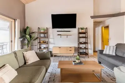 a living room with a couch and a tv at Number 1! PARADISE Getaway - Sequoia Alta Vista in Three Rivers