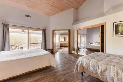 a bedroom with a large bed and a large window at Number 1! PARADISE Getaway - Sequoia Alta Vista in Three Rivers
