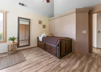 a bedroom with a bed and a mirror at Number 1! PARADISE Getaway - Sequoia Alta Vista in Three Rivers