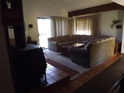 a living room with two couches and a tv at Rr-edgewater01 in June Lake