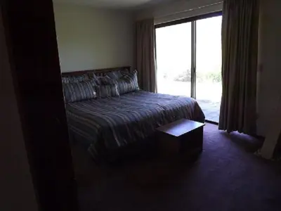 a bedroom with a bed and a large window at Rr-edgewater01 in June Lake