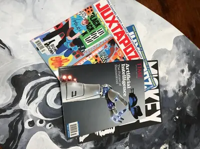 a magazine sitting on top of a table at Smart Eclectic ART HOUSE near the beat in Sacramento